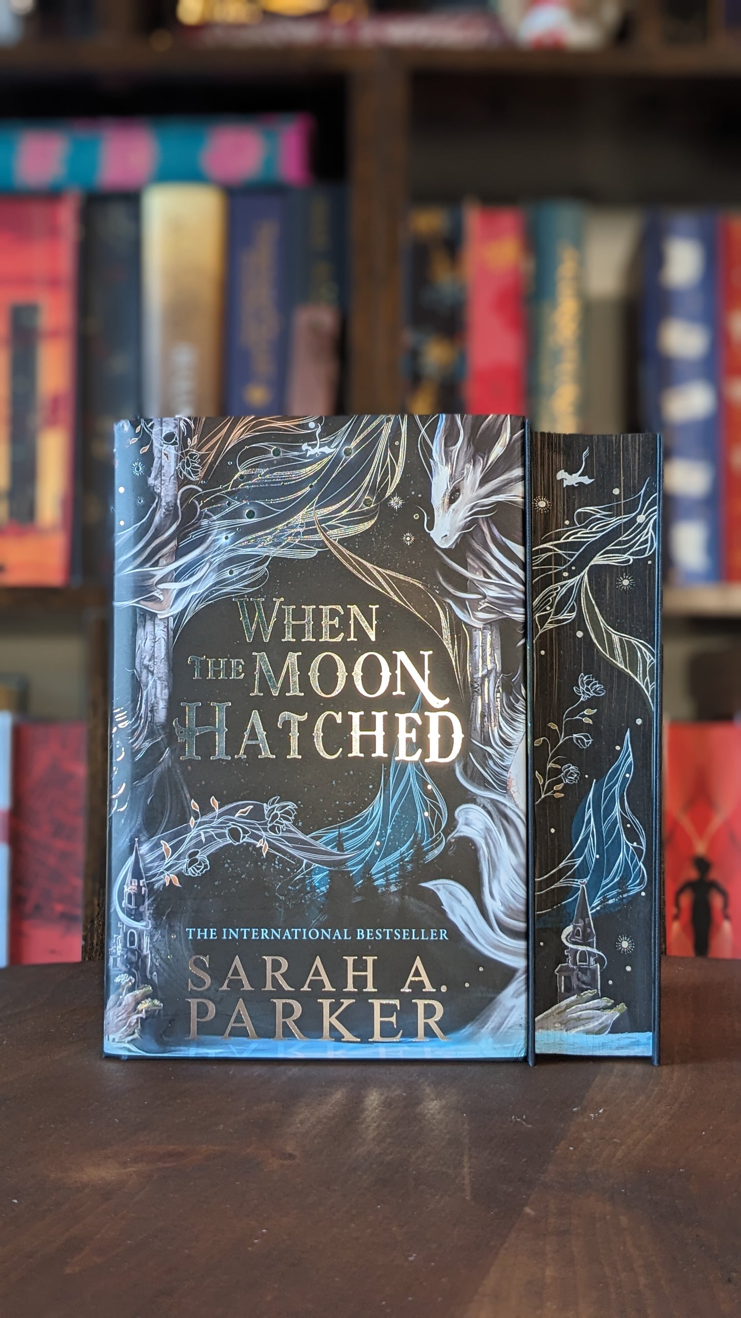 Pre order When the Moon Hatched by Sarah A Parker PeggysPages fore-edge painting sprayed edges special editions